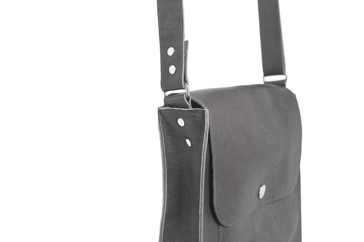 leather handbag with pouches and adjustable sewed leather strap