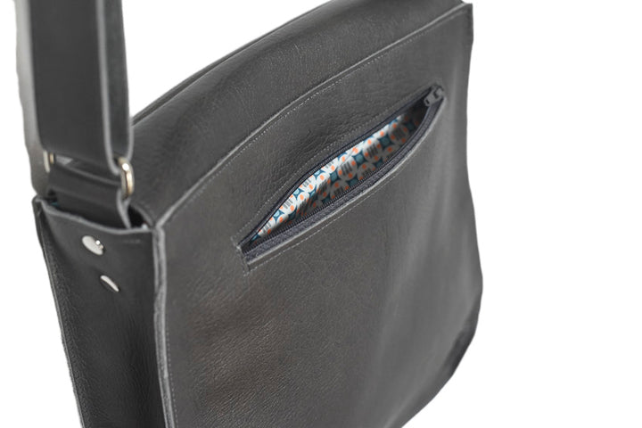 leather handbag with pouches and adjustable sewed leather strap