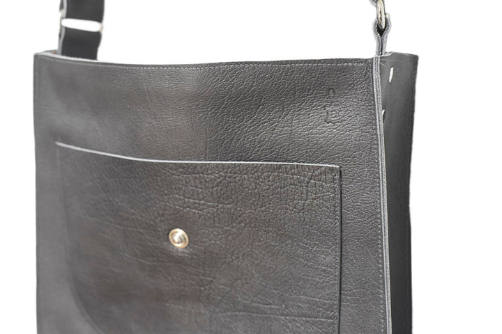 leather handbag with pouches and adjustable sewed leather strap