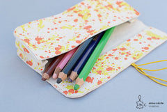 Trousse en cuir tacheté jaune et orange