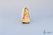 Trousse en cuir tacheté jaune et orange