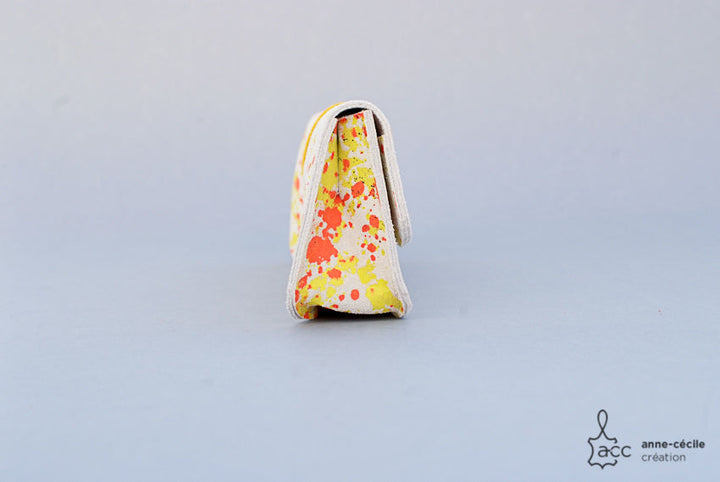 Trousse en cuir tacheté jaune et orange